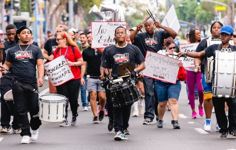 people marching with a drum